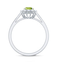 Natural half carat peridot engagement ring with diamond halo from Rosec Jewels, featuring a green peridot center stone and sparkling diamonds.