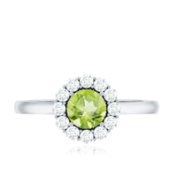 Natural half carat peridot engagement ring with diamond halo, showcasing a green peridot center and sparkling diamond accents.