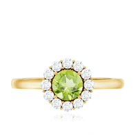 Natural half carat peridot engagement ring with diamond halo from Rosec Jewels, featuring a green peridot gemstone and sparkling diamond accents.