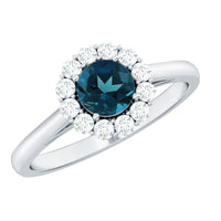 Certified London Blue Topaz and diamond halo engagement ring by Rosec Jewels featuring a central blue topaz gemstone surrounded by sparkling diamonds.
