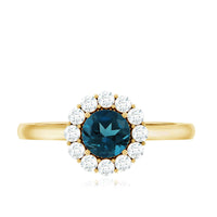 London Blue Topaz and diamond halo engagement ring by Rosec Jewels featuring a central blue topaz gemstone surrounded by sparkling diamonds.