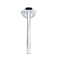 Genuine 0.9 carat blue sapphire and diamond round halo engagement ring by Rosec Jewels with intricate band detail.
