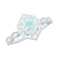 Vintage-looking Ethiopian Opal engagement ring with real diamond halo, featuring intricate metalwork and elegant design from Rosec Jewels.