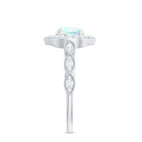Vintage Ethiopian Opal engagement ring with real diamond halo from Rosec Jewels, featuring intricate metalwork and vibrant gemstone.