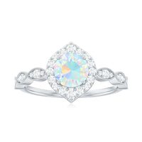 Vintage-style Ethiopian Opal engagement ring with real diamond halo, featuring intricate metalwork and elegant design from Rosec Jewels.