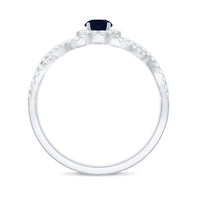 Criss cross shank blue sapphire and diamond halo engagement ring by Rosec Jewels featuring layered design and sparkling gemstones.