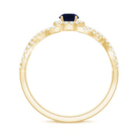 Rosec Jewels criss cross shank blue sapphire and diamond halo engagement ring showcasing a sparkling central sapphire and elegant design.