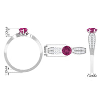 Pink tourmaline engagement ring with six prongs and diamond side stones, featuring a rose gold band from Rosec Jewels.