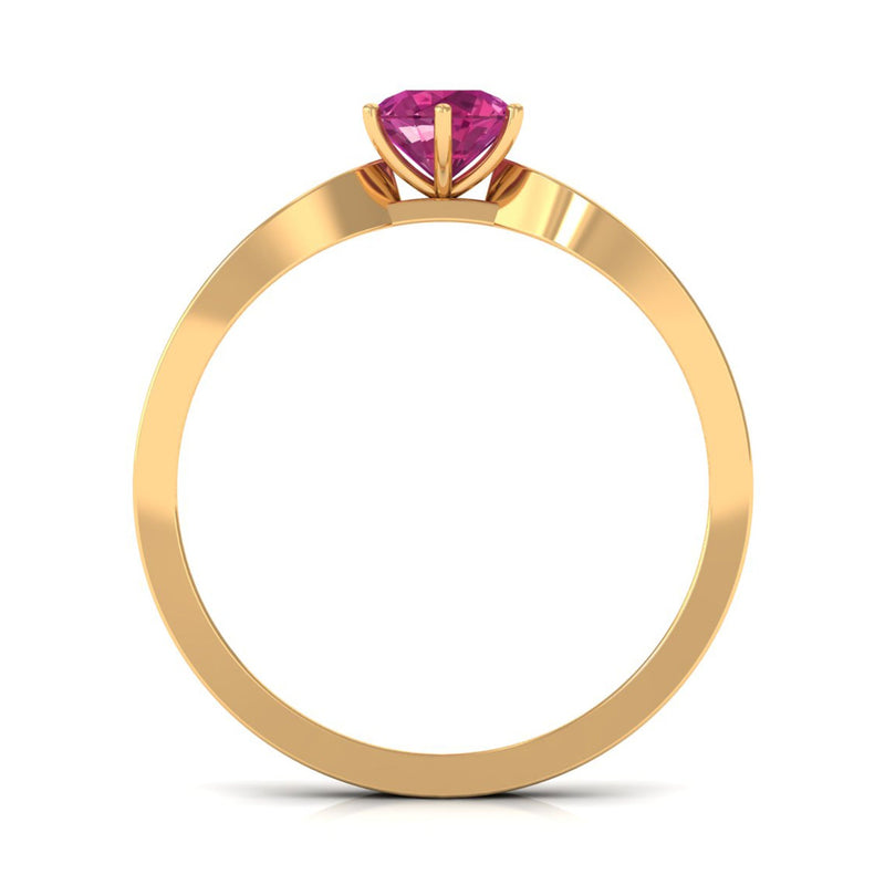 Pink Tourmaline engagement ring with six prongs and diamond side stones, set in a rose gold band by Rosec Jewels.