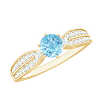 Elegant aquamarine engagement ring by Rosec Jewels featuring a central aquamarine gemstone and diamond side stones.