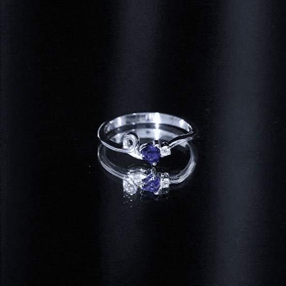 Yellow gold twisted heart promise ring featuring a certified lab-grown blue sapphire from Rosec Jewels.