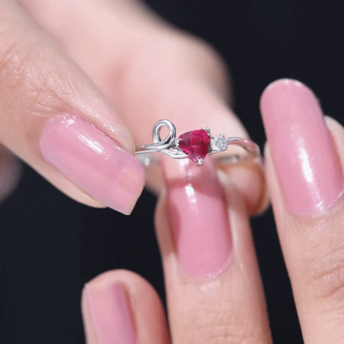 Lab created ruby and diamond twisted heart promise ring by Rosec Jewels, featuring a heart-shaped design with sparkling stones.