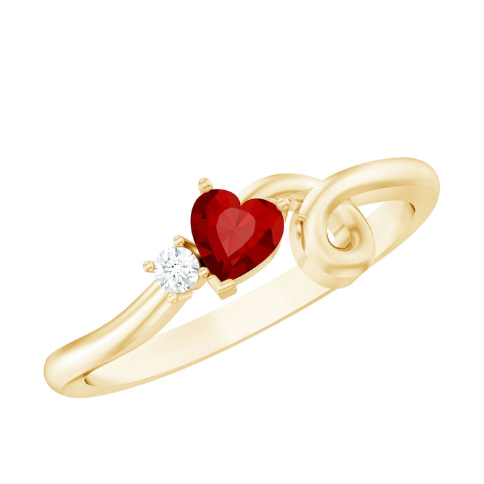 Lab created ruby and diamond twisted heart promise ring by Rosec Jewels, featuring a heart-shaped ruby and sparkling diamonds on a silver band.