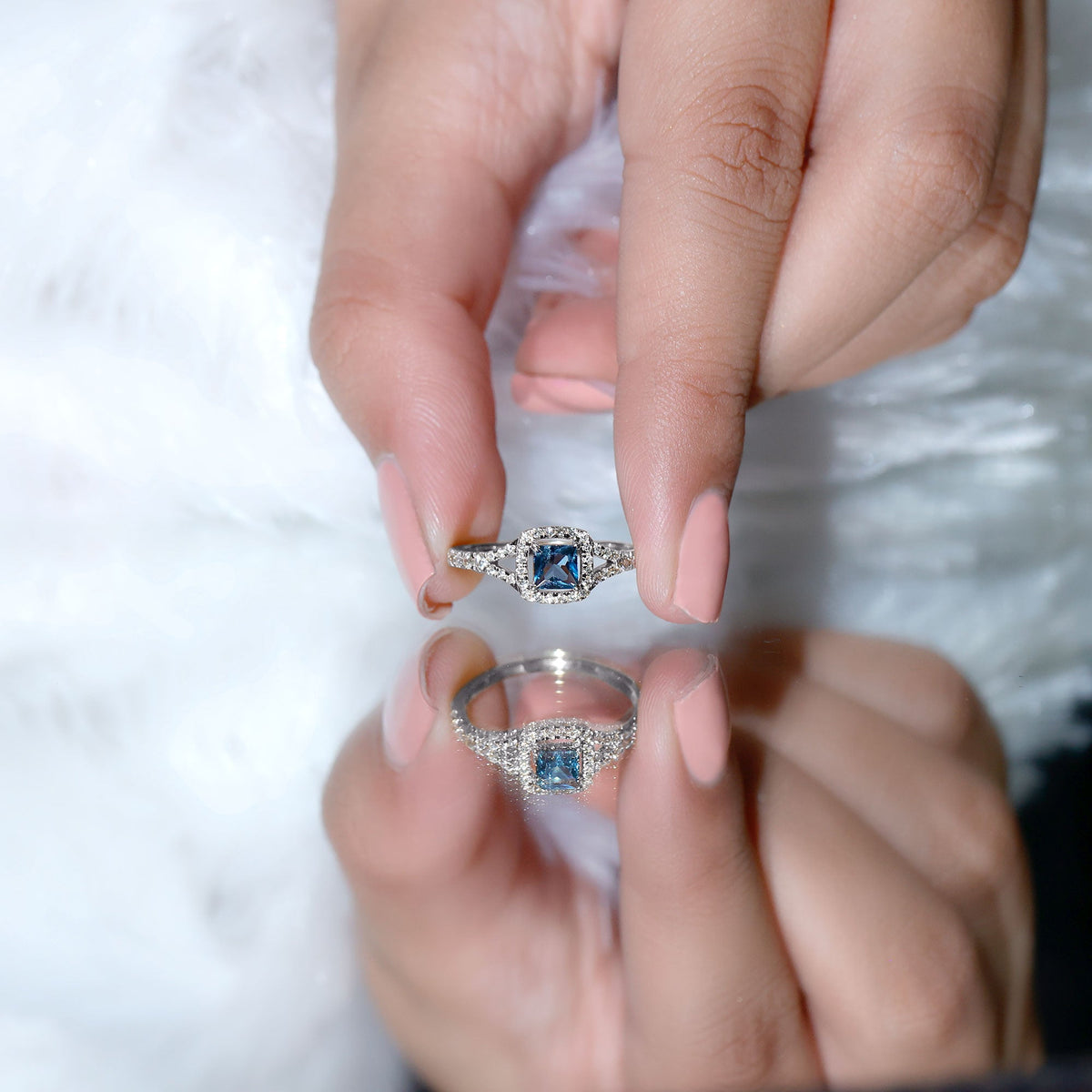 Princess cut London Blue Topaz engagement ring with diamond split shank and rose gold band, featuring a 1 carat center stone.