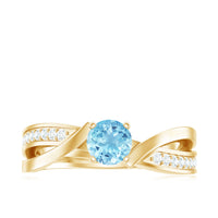 Natural 0.8 carat aquamarine and diamond infinity engagement ring by Rosec Jewels featuring a delicate band and sparkling stones.