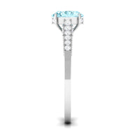 Oval 1 Carat genuine aquamarine engagement ring by Rosec Jewels with diamond side stones, showcasing the elegant ring setting.