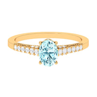 Oval 1 Carat genuine aquamarine engagement ring with diamond side stones from Rosec Jewels, showcasing the elegant ring design.