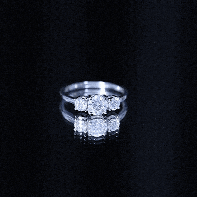 Rosec Jewels certified moissanite three stone engagement ring with white gold setting, featuring three sparkling stones for her.