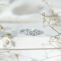 Rosec Jewels certified moissanite three stone engagement ring for women featuring sparkling gemstones and elegant silver band.
