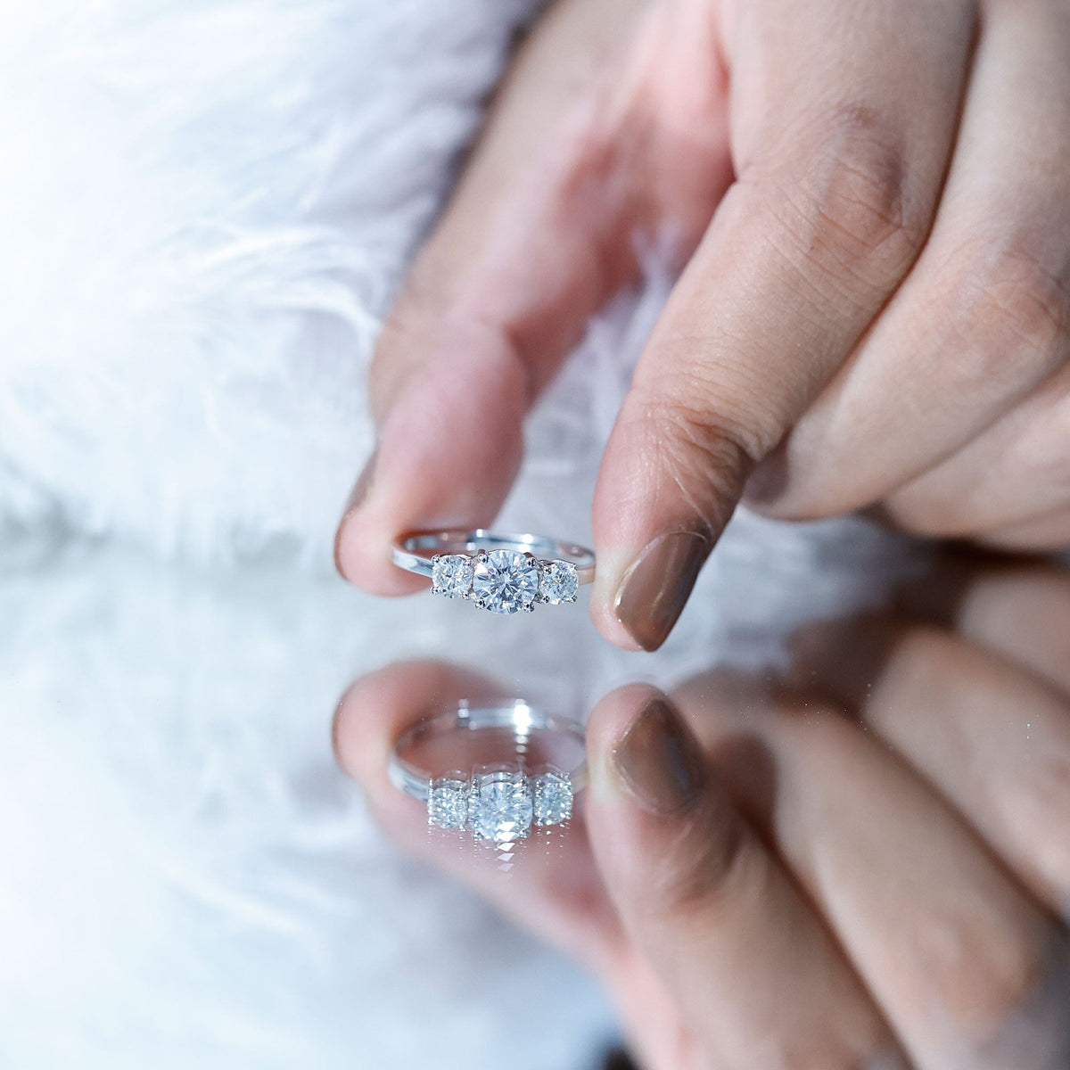 Certified moissanite three stone engagement ring for her featuring sparkling gemstones and a sleek silver band by Rosec Jewels