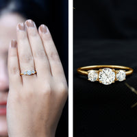 Rosec Jewels certified moissanite three stone engagement ring with sparkling stones and intricate band design.