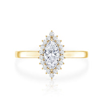Brilliant cut moissanite marquise engagement ring with side stones, set in a rose gold band, from Rosec Jewels.