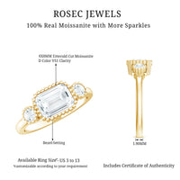 Emerald cut moissanite 3-stone engagement ring in east-west style with rose gold band from Rosec Jewels