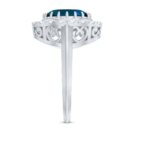Rosec Jewels London Blue Topaz engagement ring with diamond accent, featuring a bold blue gemstone and elegant setting.