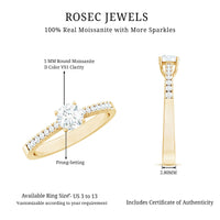 Half carat moissanite engagement ring with a solitaire setting, featuring a sparkling round moissanite stone and a polished band.