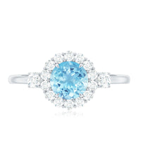 Rosec Jewels classic aquamarine engagement ring with diamond halo, featuring a sparkling aquamarine gemstone and surrounding diamonds.