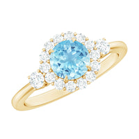 Classic aquamarine engagement ring with diamond halo from Rosec Jewels, showcasing a stunning blue gemstone and sparkling diamond accents.