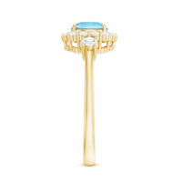 Elegant aquamarine engagement ring with diamond halo by Rosec Jewels, featuring a central gemstone surrounded by sparkling diamonds.