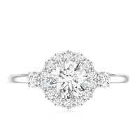 Round cut moissanite halo engagement ring from Rosec Jewels featuring a central gemstone with a detailed halo setting.