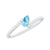 Real aquamarine and diamond promise ring with bypass shank, featuring elegant gemstones set in a Rosec Jewels ring design.