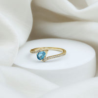 Rosec Jewels real aquamarine and diamond promise ring with bypass shank, showcasing sparkling gemstones and elegant design.