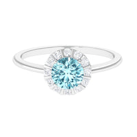 1 CT aquamarine engagement ring with diamond floating halo, featuring a rose gold band and intricate detailing.