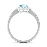 Elegant aquamarine engagement ring with diamond floating halo, featuring a 1-carat Aquamarine and sparkling diamonds by Rosec Jewels.