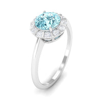 1 carat aquamarine engagement ring with diamond floating halo, rose gold band, and intricate design by Rosec Jewels.