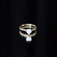 Heart-shaped Ethiopian opal and diamond engagement ring with 0.75 carats, set in a elegant Rosec Jewels ring design.