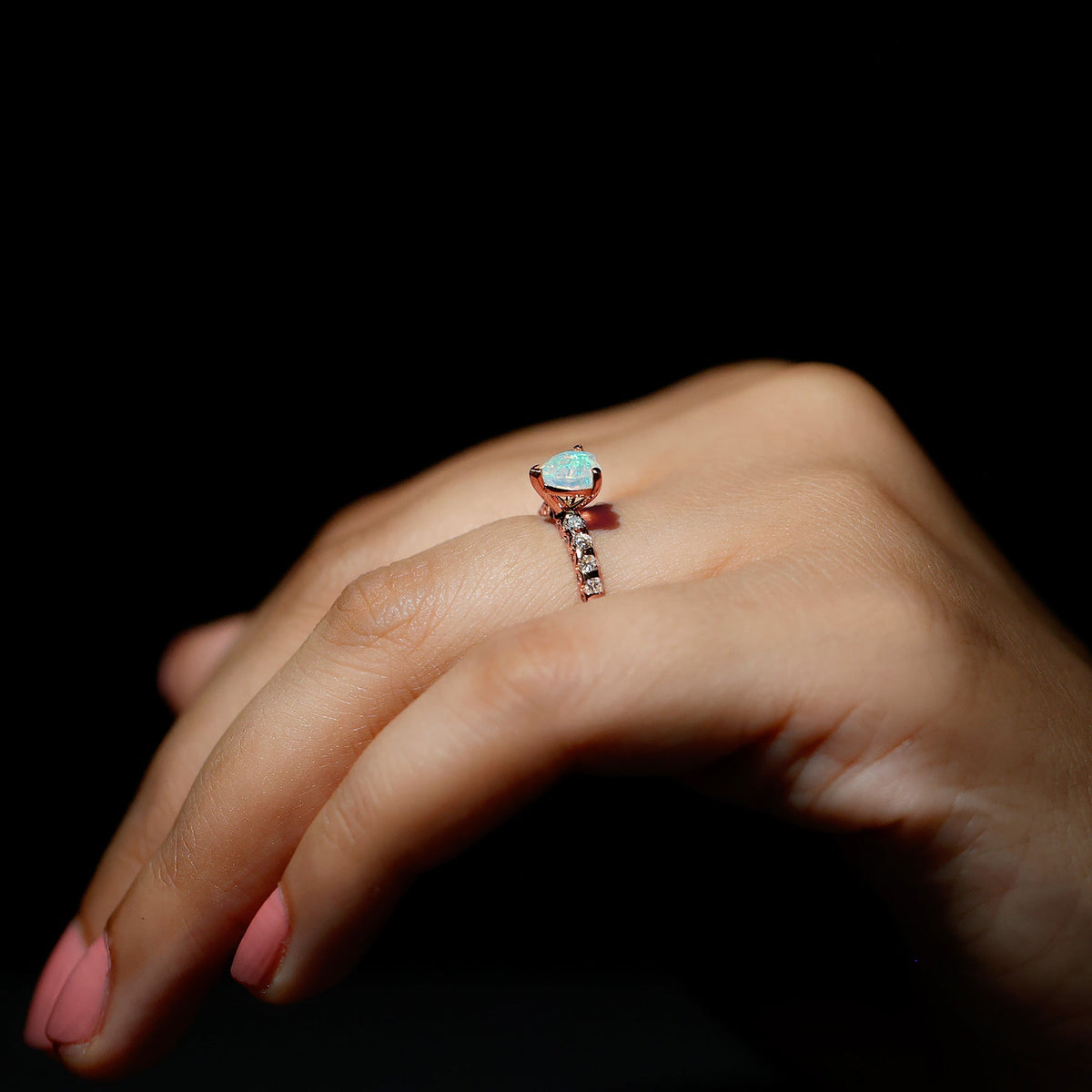 Heart-shaped Ethiopian opal and diamond engagement ring featuring a 0.75 carat stone set in a rose gold band.