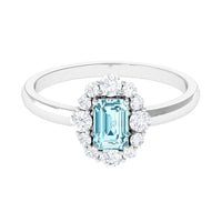 Octagon aquamarine engagement ring with diamond halo by Rosec Jewels, showcasing intricate gemstone and sparkling diamond details.