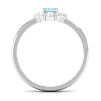 Octagon aquamarine engagement ring with diamond halo from Rosec Jewels, showcasing the central gemstone and surrounding sparkle.