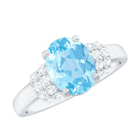 Oval cut aquamarine engagement ring with diamond collar from Rosec Jewels, showcasing a sparkling gemstone and intricate band design.