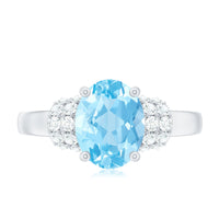Oval cut aquamarine engagement ring with diamond collar from Rosec Jewels, featuring a 1 carat center stone and intricate band design.