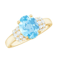 Oval cut aquamarine engagement ring with diamond collar, featuring Rosec Jewels' elegant silver band and intricate detailing.
