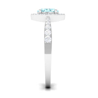 Aquamarine engagement ring with diamond halo from Rosec Jewels, showcasing a 1-carat aquamarine gemstone surrounded by sparkling diamonds.