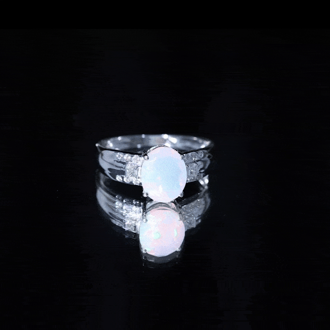 Ethiopian opal engagement ring with a 1.3 carat oblong opal and accent diamonds, crafted by Rosec Jewels.