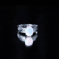 Ethiopian opal engagement ring with a 1.3 carat oblong opal and accent diamonds, crafted by Rosec Jewels.
