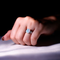 Ethiopian opal engagement ring with 1.3 carats and diamond accents, showcasing an oblong design from Rosec Jewels.