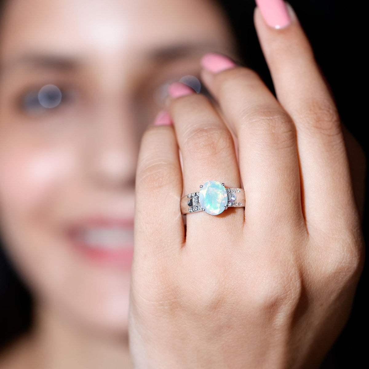Ethiopian opal engagement ring with 1.3 carats and diamond accents, featuring an elegant oblong design by Rosec Jewels.